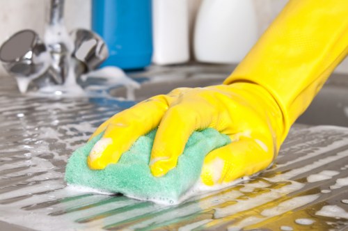 Westkensington cleaner working in a residential hallway