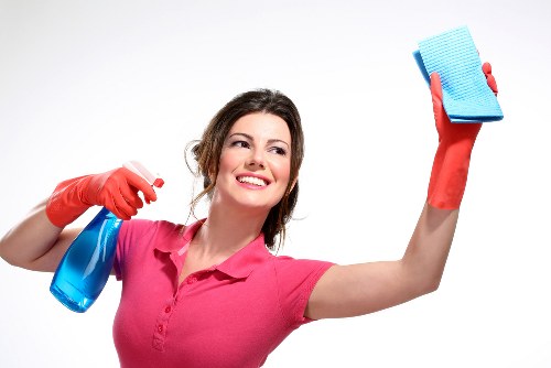 Cleaner vacuuming a flat in Westkensington with care and attention to detail